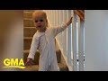 Adorable toddler takes his precious time going down the stairs