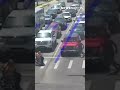 Good Samaritan in Spider-Man suit helps man in wheelchair cross the intersection