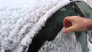 Scraping ice off the car