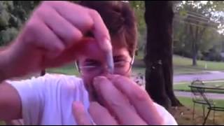 Pushing a cigarette through a quarter then to change the value of the quarte