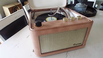 Magnavox Micomatic automatic record player playing a 33.3 RPM LP record.