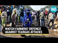 Farmers battle dronedropped teargas with kites arm themselves with wet sacks  face masks  watch