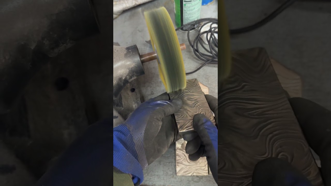 Polishing bronze castings on the buffer wheels. 