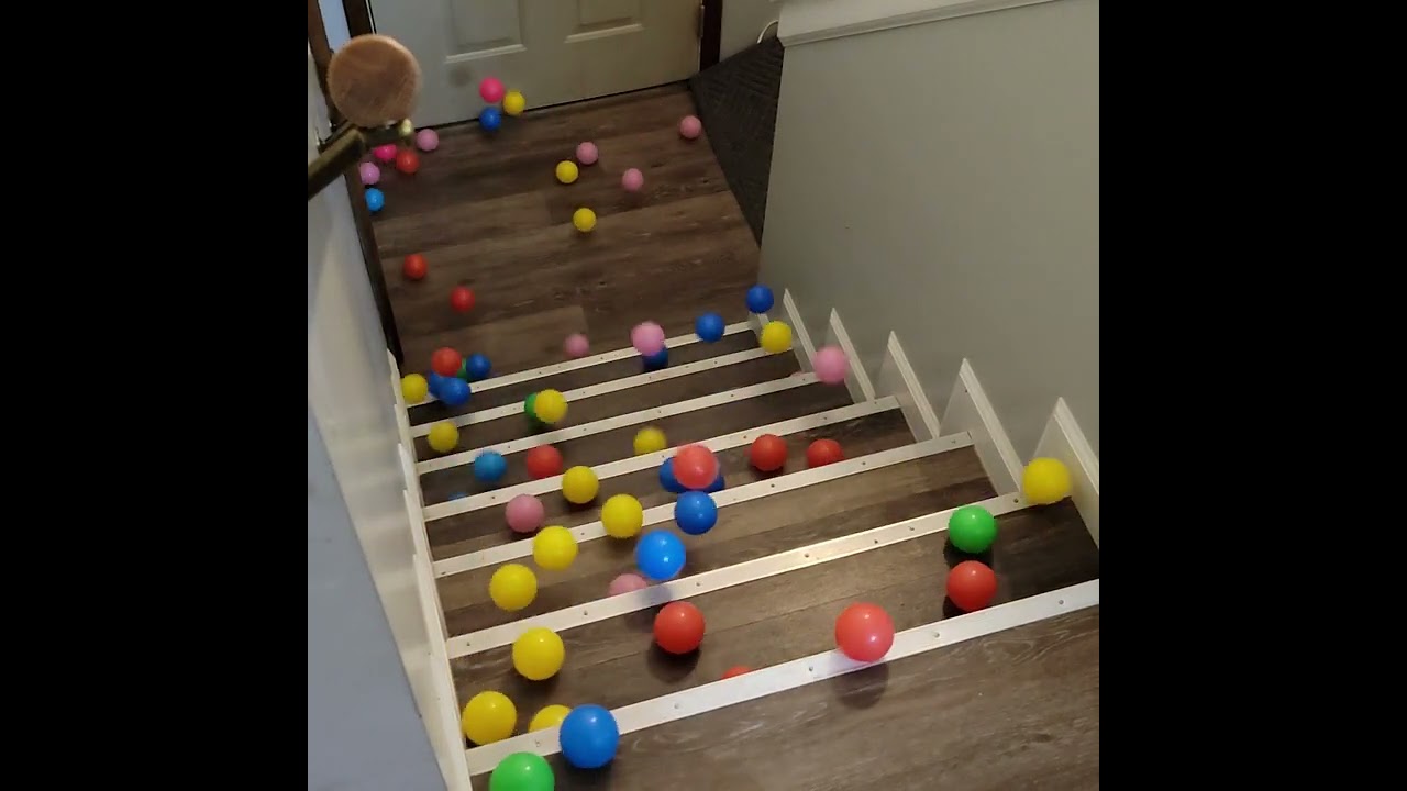 Small balls on the stairs (reversed video)