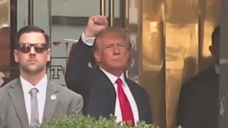 Details Trump waves to supporters ahead of turning himself in Update