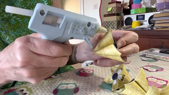 Gluing flowers to create a vase topper