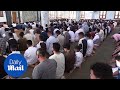 Muslims attend morning prayers to celebrate first day of Eid al-Fitr