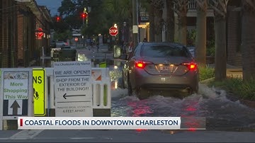 Tidal flooding shuts down roads.