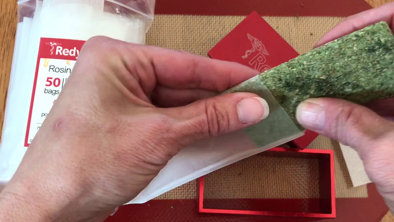 stuffing a pre-pressed puck in rosin filter bag