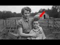 A Woman Hugs Her Son in 1931 — But Zooming In on the Boy's Face, Something Feels Off