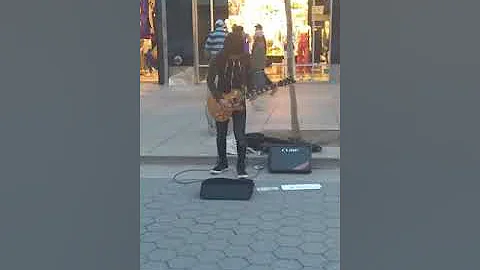 Kazuki Tokaji guitarist player at 3rd Street Promenade in Santa Monica Beach, California.