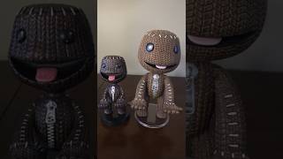 The Cable Guys Sackboy controller holder and the much older LittleBigPlanet one