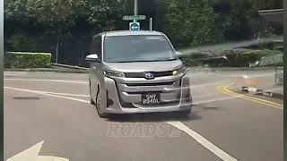 A car failed to maintain its lane while turning and nearly entered the path of an oncoming vehicle.