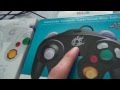 Nintendo Gamecube Controller Adapter and white Smash Bros. Controller