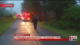 Coroner responding to house fire