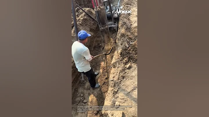 Teamwork & precision:  installing a large concrete pipe