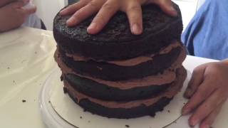 4 layers of dark, moist chocolate cake, layered with buttercream,
frosted milk ganache, topped handmade gold dusted b...