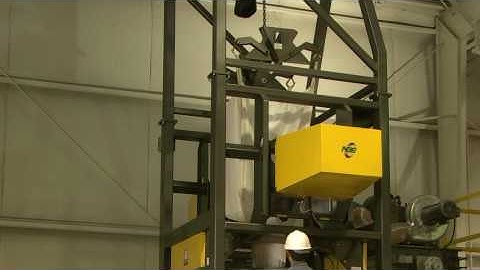 Bulk Bag Hanger with Integrated Flow Aid to Ensure Complete Material Discharge