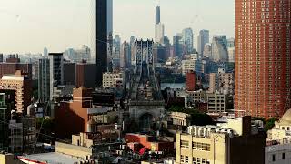 Aerial view of New York City's Manhattan Bridge and East River during late afternoon