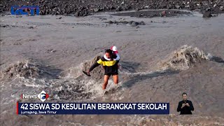 Siswa SD di Lumajang Digendong Saat Sebrangi Aliran Lahar Gunung Semeru #SeputariNewsSiang 10/10