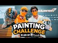 Carlos Sainz and Lando Norris paint for Mind