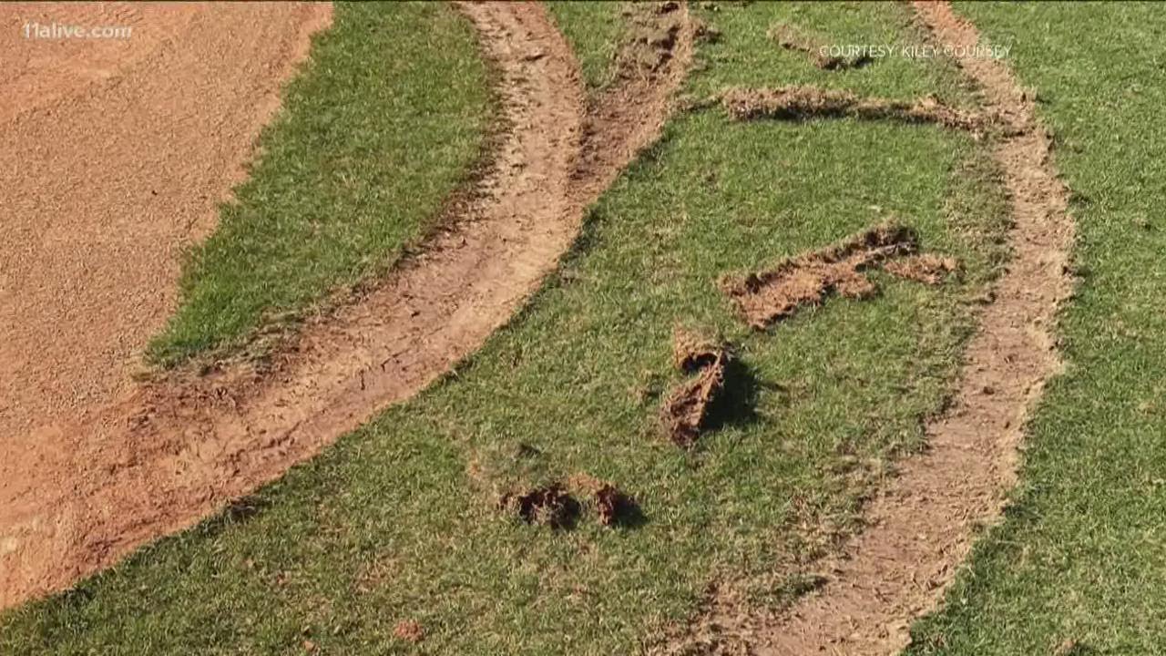 Gwinnett Stripers help repair baseball field at Collins Hill High after it was vandalized