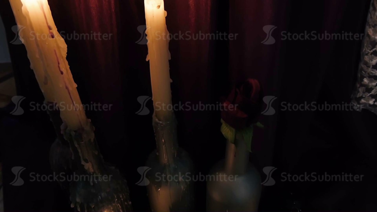 Candles are lit in a dark room YouTube