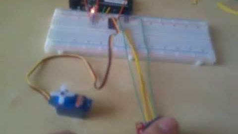 Arduino: control a LED and one servo motor using a joystick