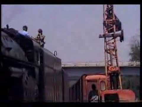 Steam locomotive 1218 taking on coal then leaving Asheville for Spencer in 1989. The whistle on this one makes the others seem whimpy! Watch the guy in the P...