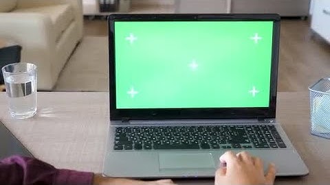 Working On A Laptop With Green Screen Mock-Up Stock Video