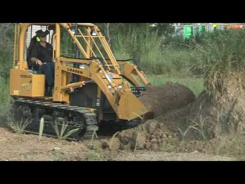 Footage of the new East Wind YCT Mark 2 Series Loader Dozer footage. The Loader Dozer is great in all terrain and has a 4-in-1 front end loader and comes with pto, 3-point linkage and hydraulic remotes for driving a huge range of implements. Perfect for small acreage farms and lifestyle properties. Made for Australian conditions. YCT Dozers distributed throught Australia, New Zealand and the South Pacific region by East Wind Australia. Visit www.eastwind.com.au for more information and ordering your Free DVD (For Australia, New Zealand and South Pacific areas only)