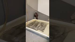 Darkroom washing an abstract photograph on linen made with my own silver gelatin emulsion screenshot 4