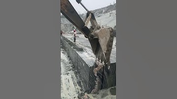 the process of transporting concrete blocks using heavy equipment #construction #popular #shorts