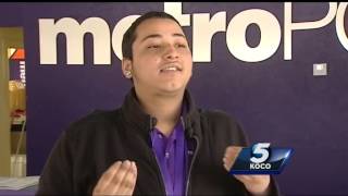 Surveillance footage shows masked robbers steal from MetroPCS store