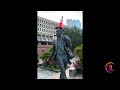 Why are Scotland fans putting traffic cones on statues in Boston?