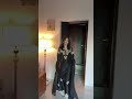 Golden hand embellishments shimmering against classic black,| Closet Cloud