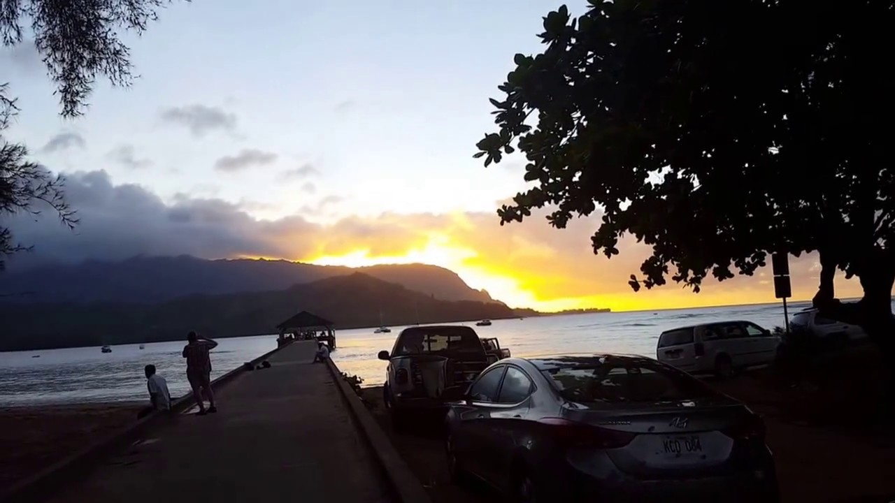 Walking to the Hanalei pier at sunset