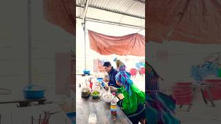 A bowl of pho costing 20,000 VND is enjoyed heartily by the locals at the market