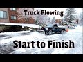 Truck snowplowing a parking lot from start to finish 4 k Video