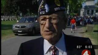 Volunteers place flags at vets' graves