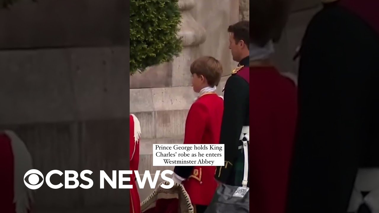 Prince George helps carry his grandfather King Charles III’s train. #shorts