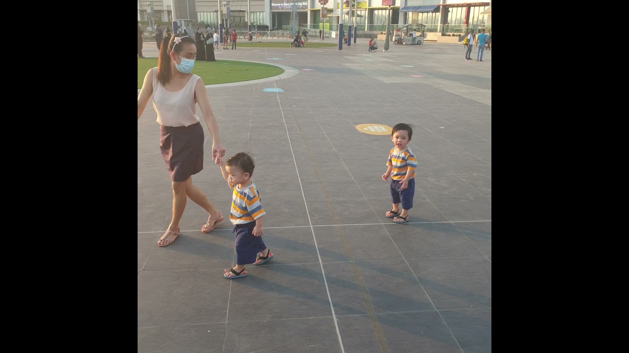 Twin boys first strolling during covid 