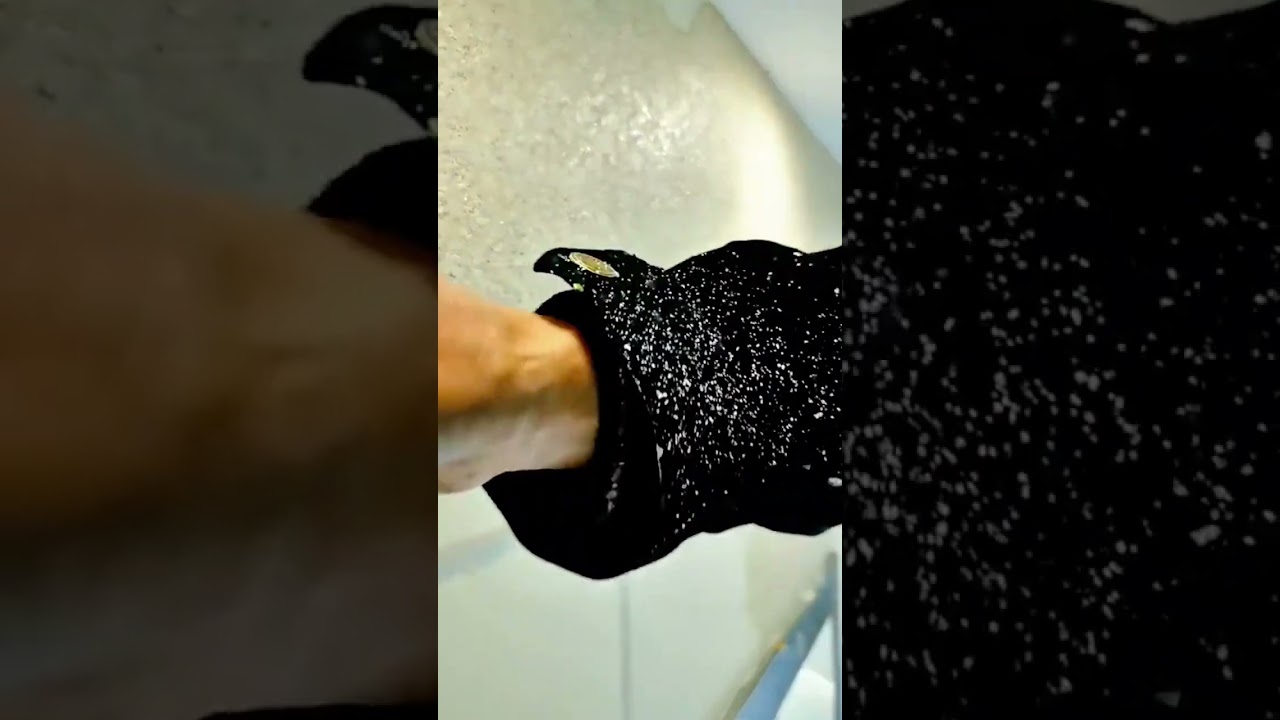 smoothing texture cement on building wall surfaces using a putty knife in order to get maximum