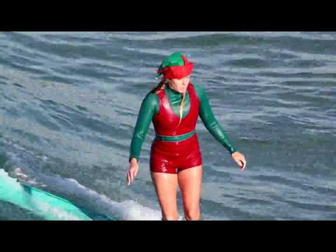 Santa and his elves take a much needed break to go surfing