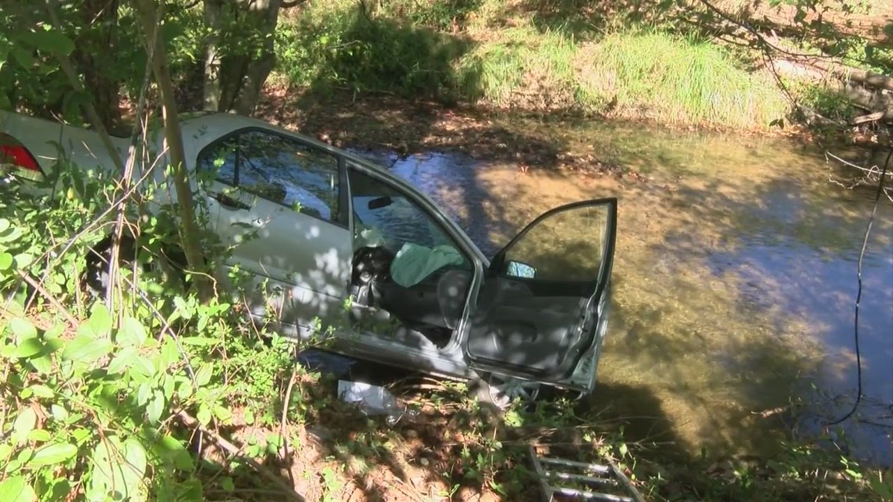 Woman crashes car into body of water off Milligan Highway YouTube