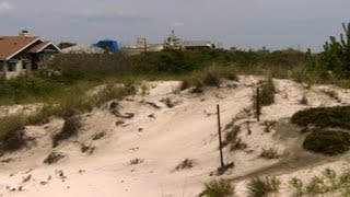 Coastal communities debate sand dunes after Sandy