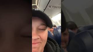 Passenger found inside overhead luggage compartment