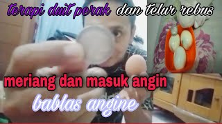 Kerokan untuk masuk angin pake duit perak dan telur rebus