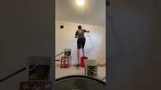 Man Loses Balance and Falls Off Crate While Painting a Wall