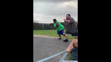 two fat people run a race! Big guy falls hard